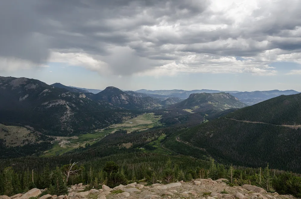 Forested slopes and peaks of Rocky Mountain National Park from Many Parks Curve overlook
