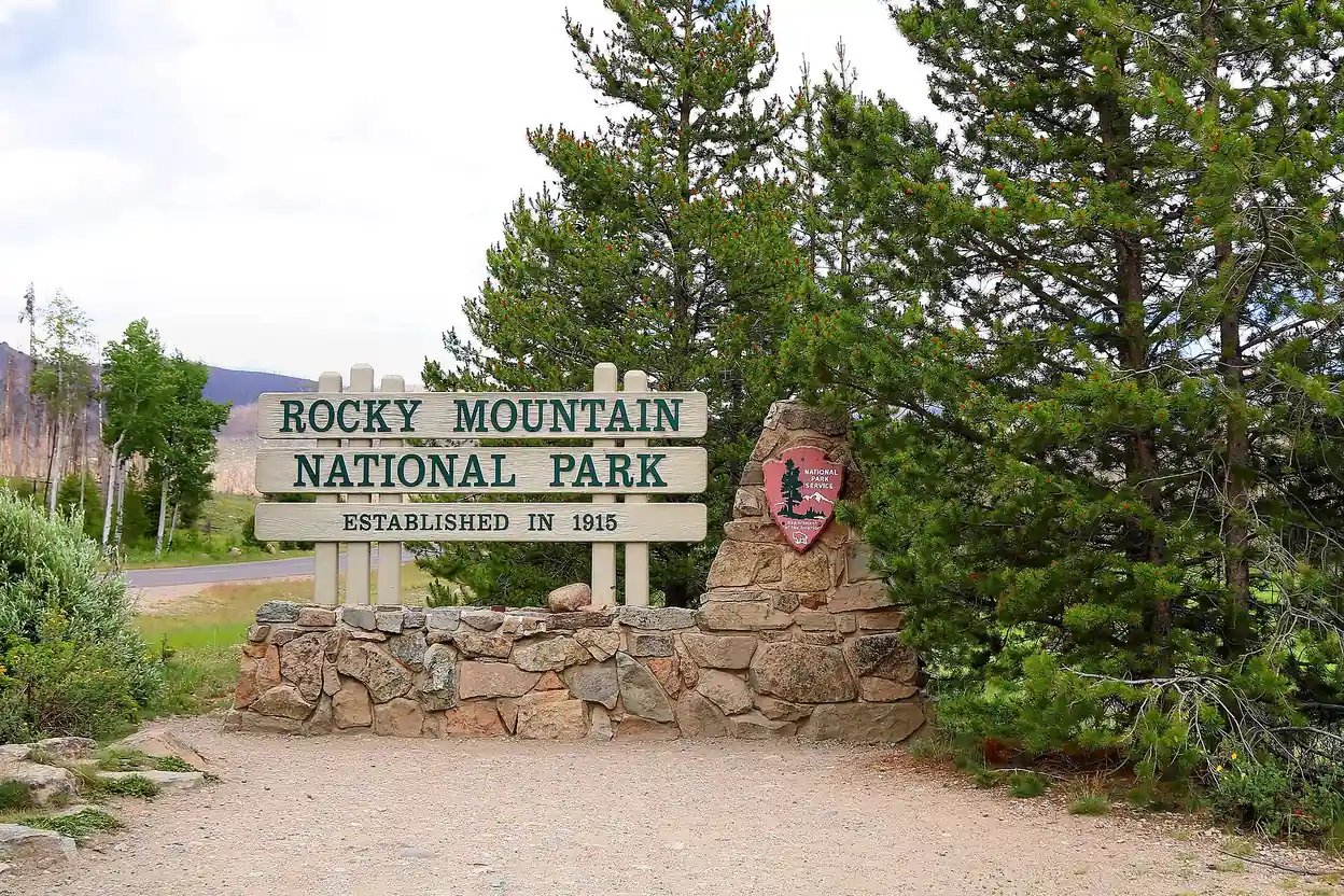Rocky Mountain National Park entrance sign beside the road near Grand Lake, Colorado