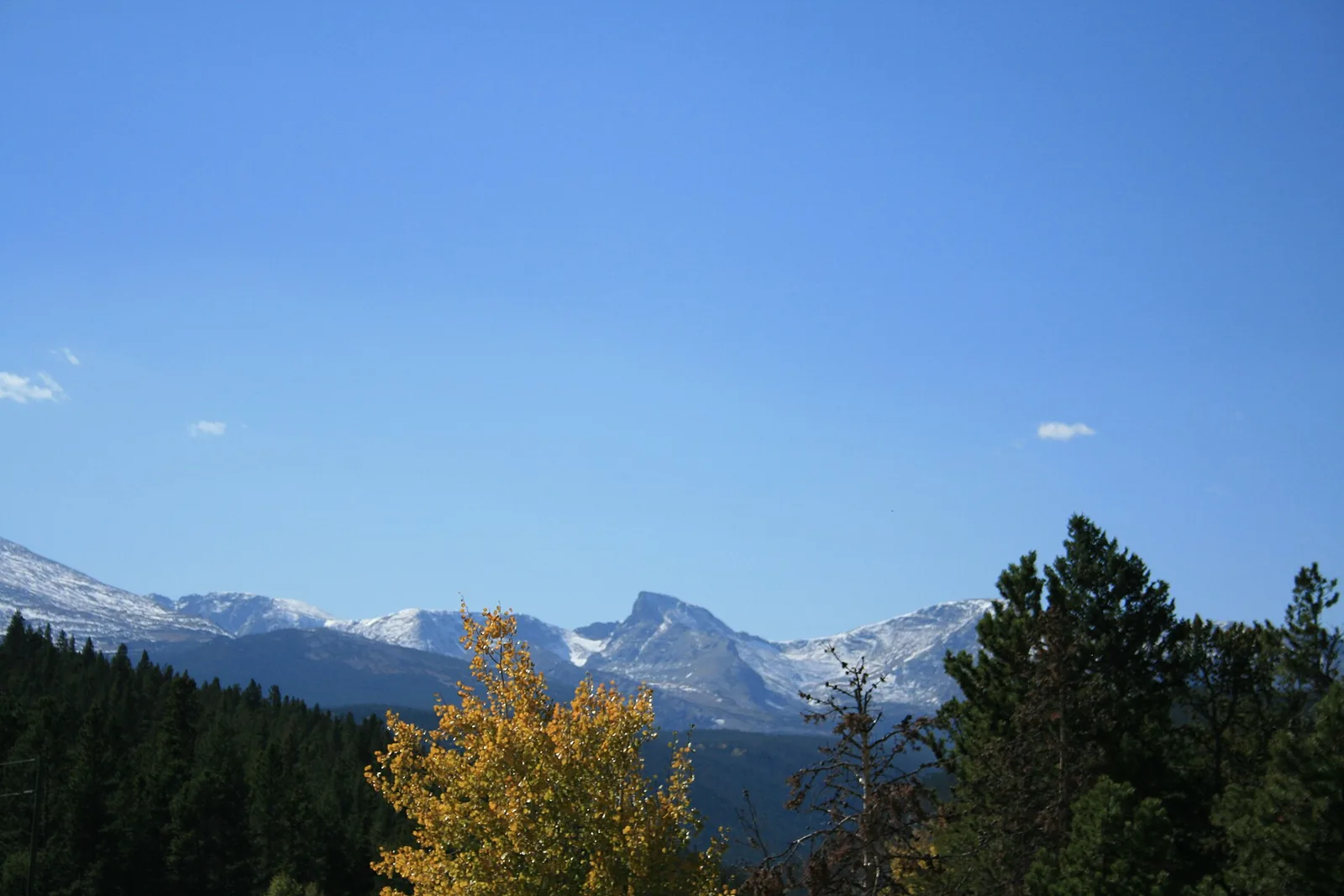 Mountain peaks rising above the Peak to Peak Scenic Byway in Colorado